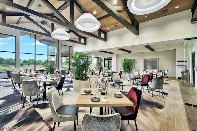 9010 Arrezo Ct, Naples, FL 34119 - dining room featuring high vaulted ceiling and a wood ceiling with exposed beams