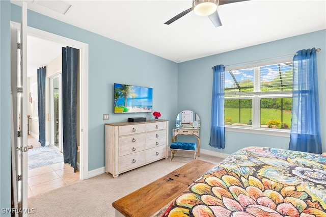 14687 Topsail Dr, Naples, FL 34114 - bedroom with light colored carpet, baseboards, ceiling fan, and light tile patterned flooring