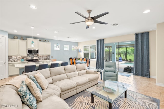14687 Topsail Dr, Naples, FL 34114 - living area with a ceiling fan, recessed lighting, baseboards, and light tile patterned floors