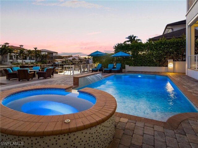 434 Conners Ave, Naples, FL 34108 - view of swimming pool featuring a pool with connected hot tub and a patio area