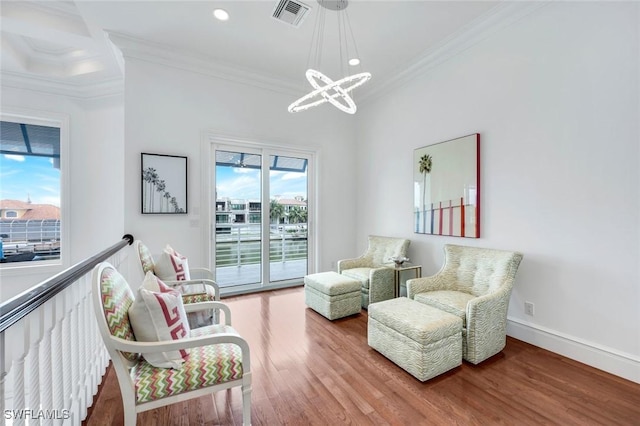 434 Conners Ave, Naples, FL 34108 - sitting room featuring a chandelier, crown molding, wood finished floors, and recessed lighting