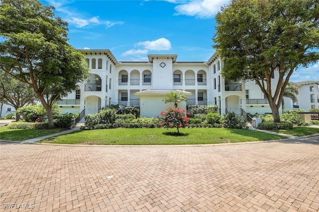 795 Bentwater Cir Unit 202, Naples, FL 34108 - view of front of home featuring a front yard and stucco siding