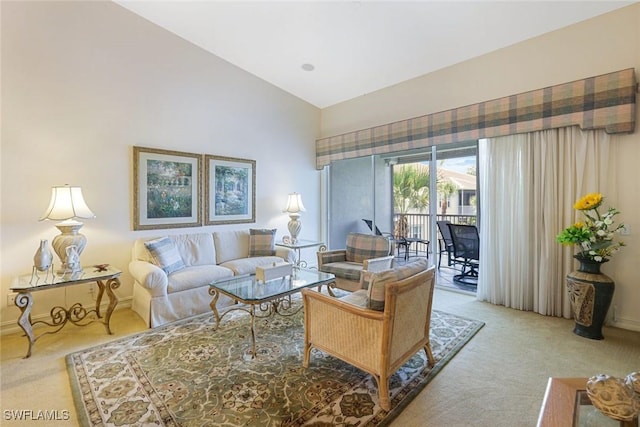 795 Bentwater Cir Unit 202, Naples, FL 34108 - living room featuring carpet flooring, high vaulted ceiling, and baseboards