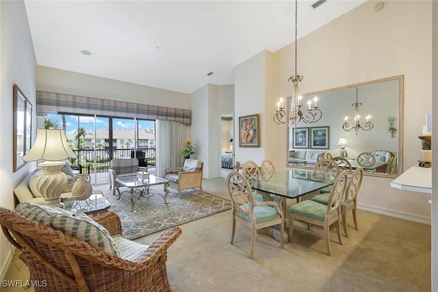 795 Bentwater Cir Unit 202, Naples, FL 34108 - dining area featuring high vaulted ceiling, a chandelier, carpet flooring, and baseboards