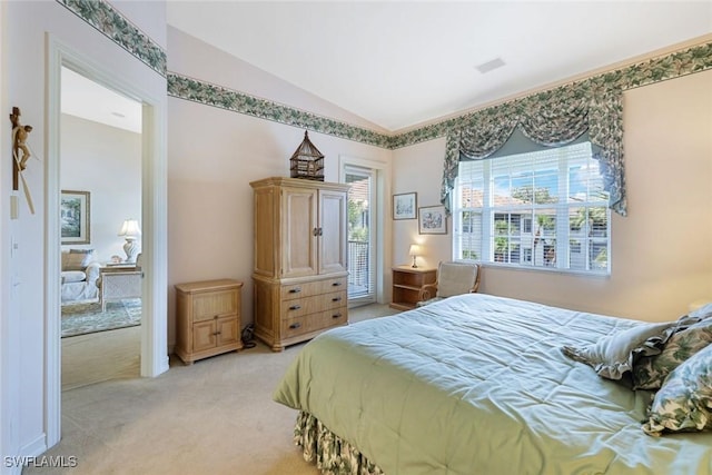 795 Bentwater Cir Unit 202, Naples, FL 34108 - bedroom featuring carpet floors and vaulted ceiling
