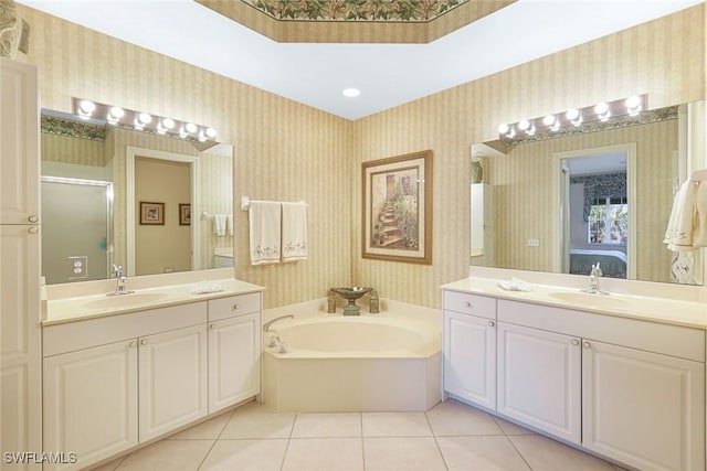 795 Bentwater Cir Unit 202, Naples, FL 34108 - ensuite bathroom featuring wallpapered walls, tile patterned floors, a garden tub, a stall shower, and two vanities