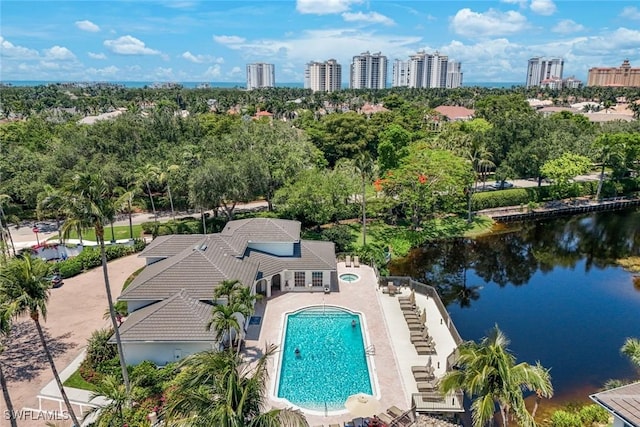 795 Bentwater Cir Unit 202, Naples, FL 34108 - bird's eye view of a tree filled landscape, a large body of water, and a pool
