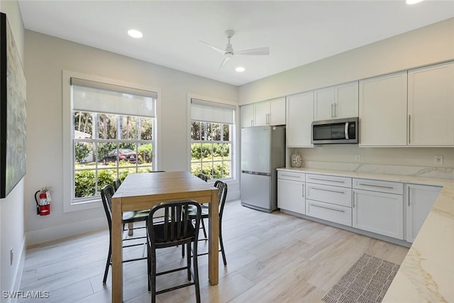 795 Bentwater Cir Unit 202, Naples, FL 34108 - kitchen featuring stainless steel appliances, healthy amount of natural light, a ceiling fan, light wood finished floors, and recessed lighting