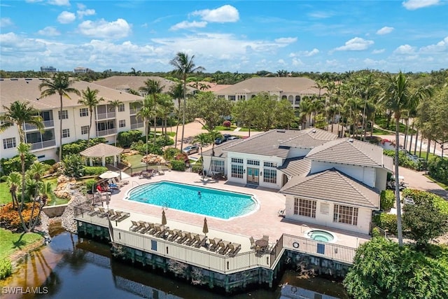 795 Bentwater Cir Unit 202, Naples, FL 34108 - community pool featuring an in-ground hot tub, a patio, french doors, and a residential view