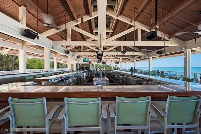795 Bentwater Cir Unit 202, Naples, FL 34108 - view of patio with a bar and a water view