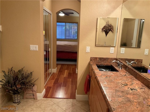 17560 Brickstone Loop, Fort Myers, FL 33967 - bathroom featuring baseboards, vanity, ensuite bathroom, and tile patterned flooring