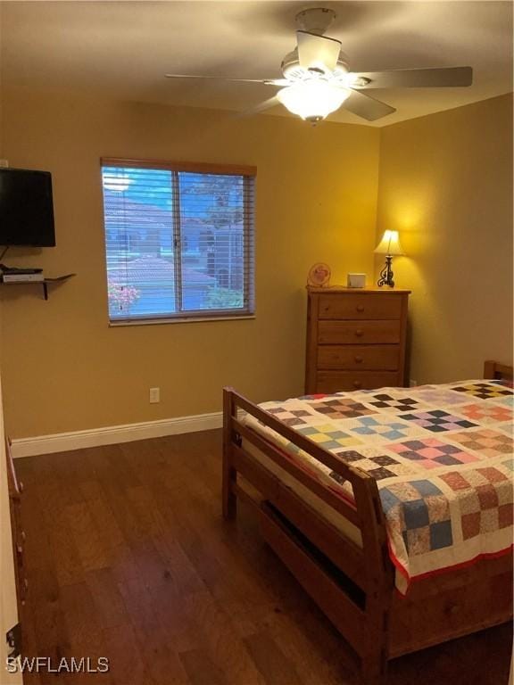17560 Brickstone Loop, Fort Myers, FL 33967 - bedroom with dark wood-style flooring, baseboards, and a ceiling fan
