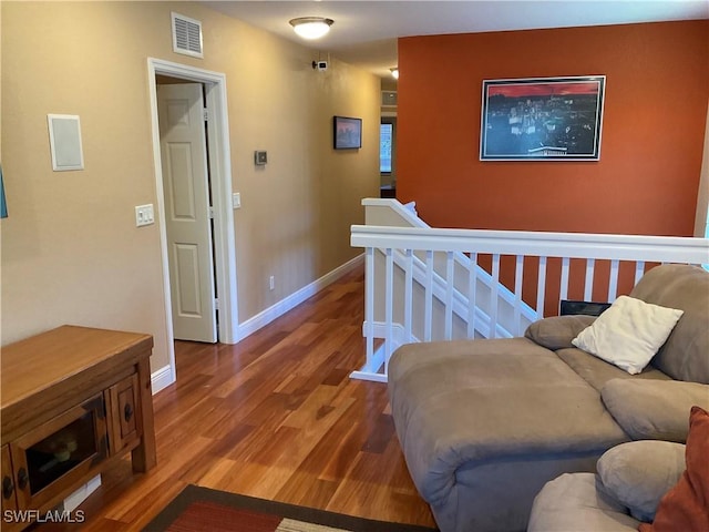 17560 Brickstone Loop, Fort Myers, FL 33967 - hall with an upstairs landing, wood finished floors, and baseboards