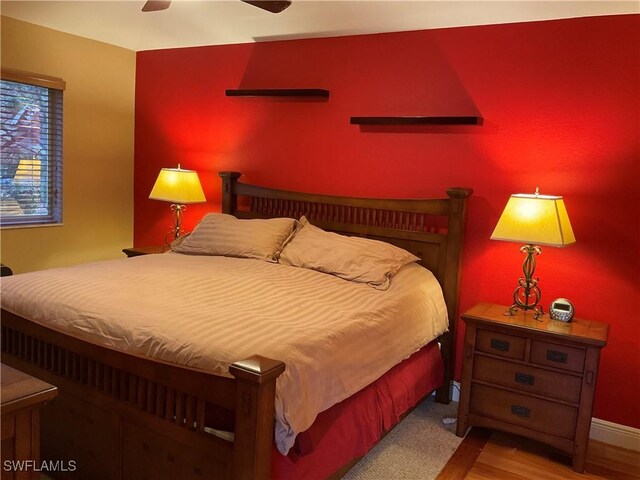 17560 Brickstone Loop, Fort Myers, FL 33967 - bedroom with baseboards, light wood finished floors, and a ceiling fan