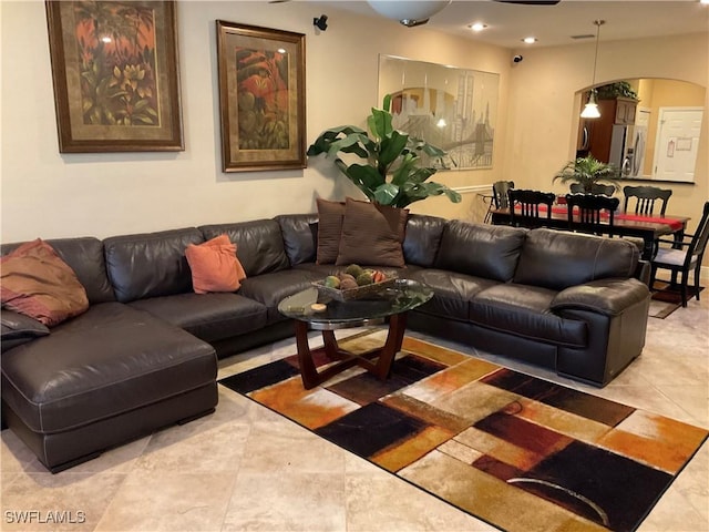 17560 Brickstone Loop, Fort Myers, FL 33967 - living area featuring arched walkways, recessed lighting, and light tile patterned floors