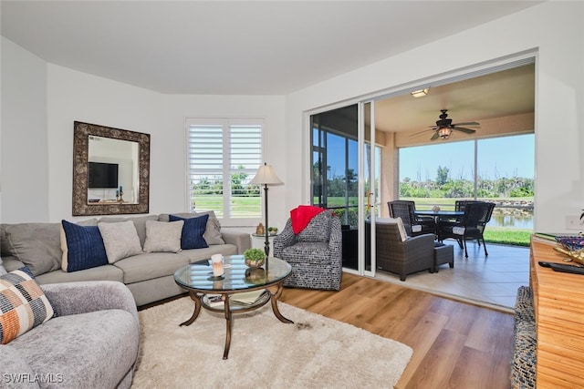 16410 Millstone Cir Unit 102, Fort Myers, FL 33908 - living room with ceiling fan and wood finished floors