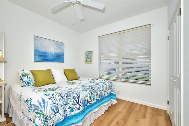 16410 Millstone Cir Unit 102, Fort Myers, FL 33908 - bedroom featuring wood finished floors, a closet, baseboards, and a ceiling fan