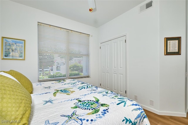 16410 Millstone Cir Unit 102, Fort Myers, FL 33908 - bedroom featuring wood finished floors, a closet, and baseboards