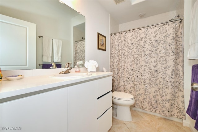 16410 Millstone Cir Unit 102, Fort Myers, FL 33908 - bathroom with vanity, toilet, tile patterned flooring, and a shower with curtain