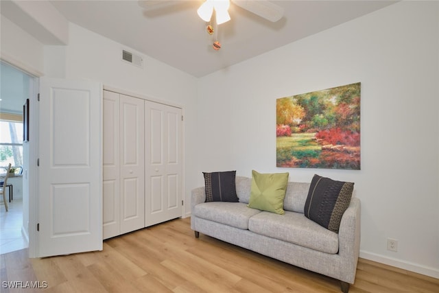 16410 Millstone Cir Unit 102, Fort Myers, FL 33908 - living area with a ceiling fan and light wood-style floors