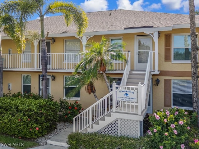 1155 Mainsail Dr Unit 503, Naples, FL 34114 - view of building exterior featuring stairs