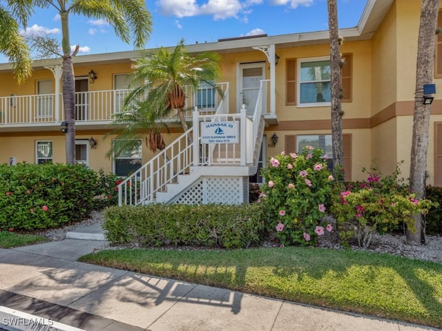 1155 Mainsail Dr Unit 503, Naples, FL 34114 - view of property featuring stairway