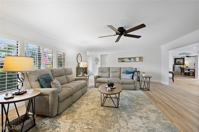 636 Park Shore Dr, Naples, FL 34103 - living area featuring a ceiling fan, wood finished floors, and crown molding