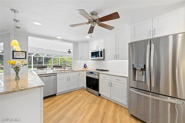 636 Park Shore Dr, Naples, FL 34103 - kitchen with appliances with stainless steel finishes, ceiling fan, white cabinets, recessed lighting, and ornamental molding