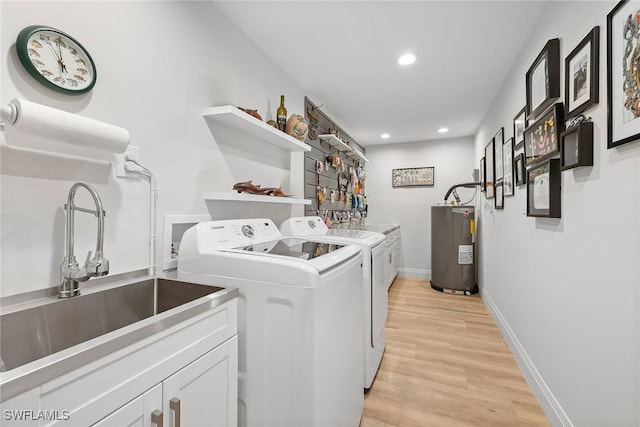 636 Park Shore Dr, Naples, FL 34103 - laundry area with washing machine and dryer, electric water heater, cabinet space, recessed lighting, and light wood finished floors