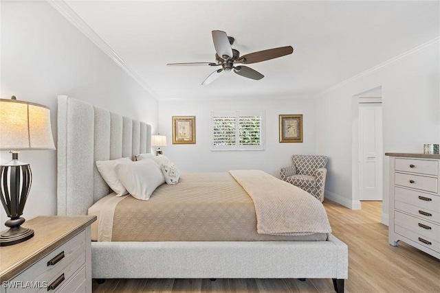 636 Park Shore Dr, Naples, FL 34103 - bedroom with crown molding, light wood finished floors, and a ceiling fan