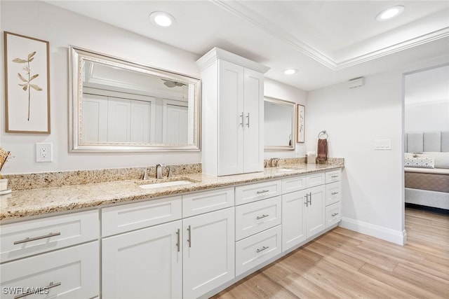 636 Park Shore Dr, Naples, FL 34103 - ensuite bathroom featuring double vanity, wood finished floors, and recessed lighting
