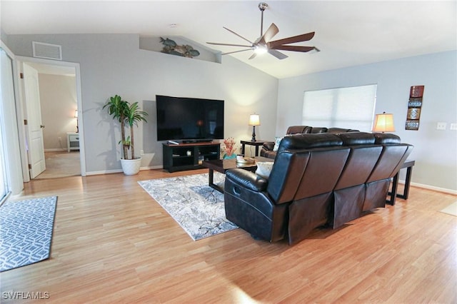 1129 NW 19th Ave, Cape Coral, FL 33993 - living room with ceiling fan, light wood-type flooring, lofted ceiling, and baseboards