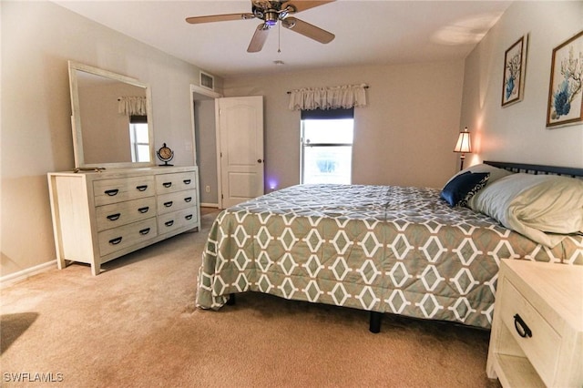 1129 NW 19th Ave, Cape Coral, FL 33993 - bedroom featuring light carpet, a ceiling fan, and baseboards