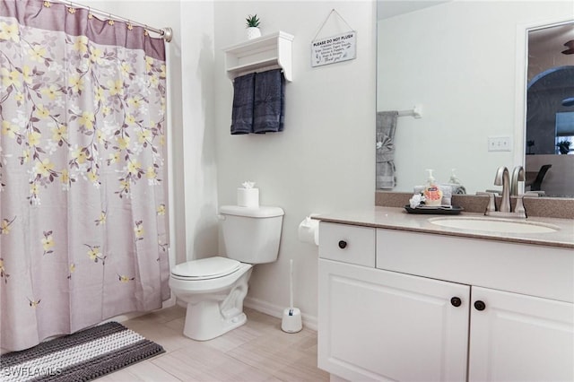 1129 NW 19th Ave, Cape Coral, FL 33993 - full bathroom with toilet, vanity, baseboards, curtained shower, and tile patterned floors
