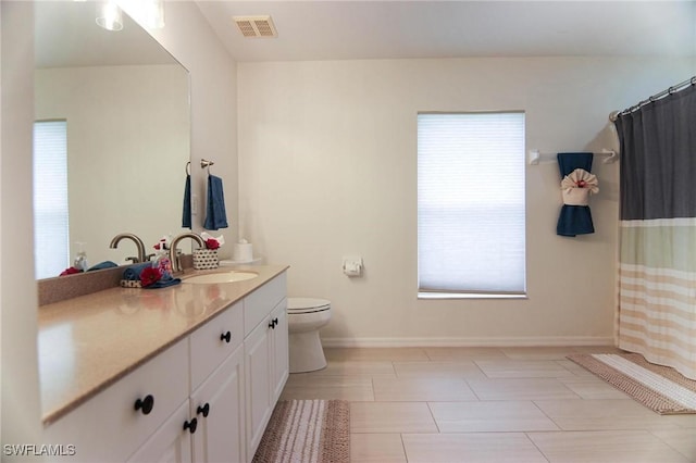 1129 NW 19th Ave, Cape Coral, FL 33993 - bathroom featuring vanity, toilet, and baseboards