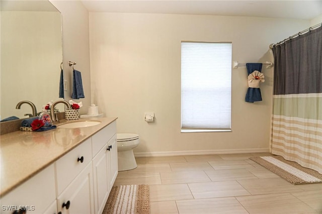 1129 NW 19th Ave, Cape Coral, FL 33993 - full bathroom with vanity, healthy amount of natural light, baseboards, and toilet