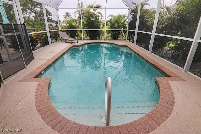 1129 NW 19th Ave, Cape Coral, FL 33993 - swimming pool featuring a lanai and a patio area