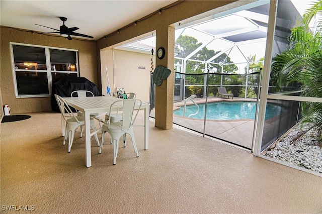 1129 NW 19th Ave, Cape Coral, FL 33993 - swimming pool with a patio, ceiling fan, glass enclosure, and outdoor dining area