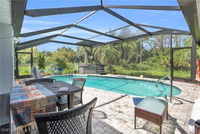2907 Ashburn St, Lehigh Acres, FL 33972 - outdoor pool with a hot tub, a patio, and glass enclosure