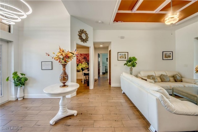 141 SW 39th St, Cape Coral, FL 33914 - living room with a chandelier, light wood-type flooring, and baseboards
