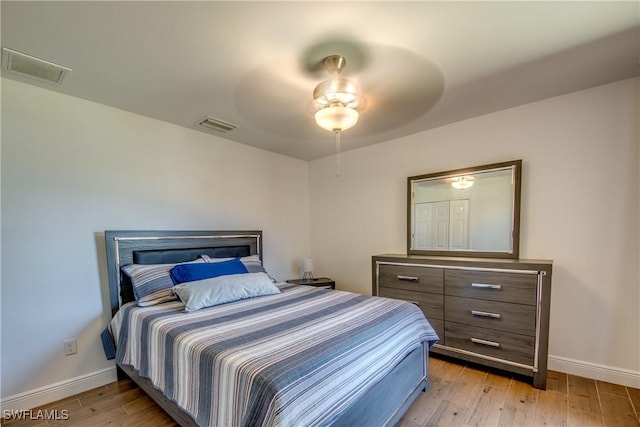 141 SW 39th St, Cape Coral, FL 33914 - bedroom with baseboards, light wood finished floors, and a ceiling fan