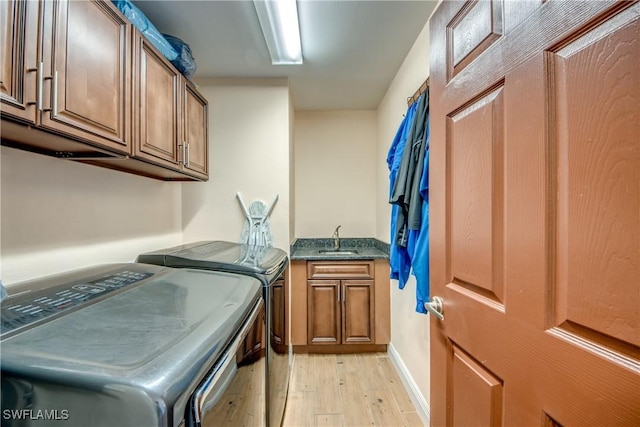 141 SW 39th St, Cape Coral, FL 33914 - laundry area with independent washer and dryer, cabinet space, and light wood-style floors