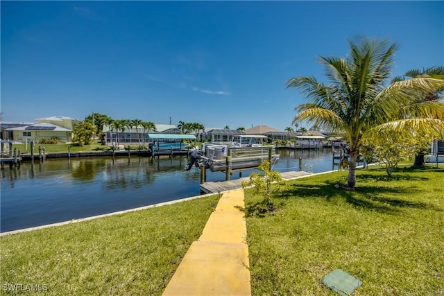 141 SW 39th St, Cape Coral, FL 33914 - dock with a water view, a lawn, and boat lift