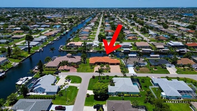 141 SW 39th St, Cape Coral, FL 33914 - aerial view of property and surrounding area with nearby suburban area and a large body of water