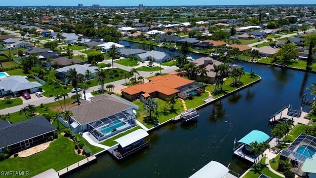 141 SW 39th St, Cape Coral, FL 33914 - aerial view of residential area with a large body of water