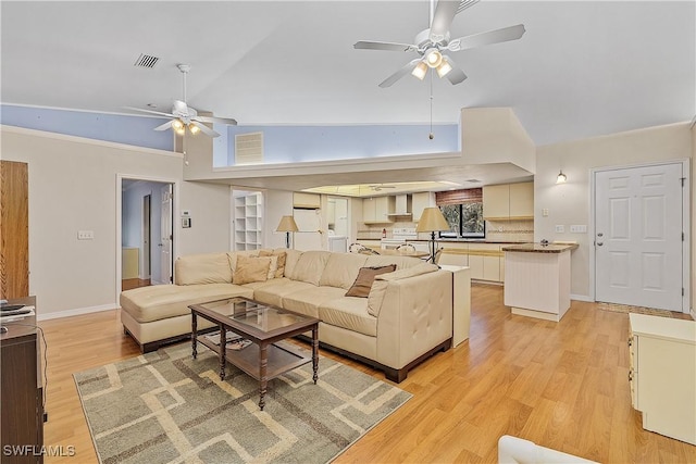 7836 Grande Pine Rd, Bokeelia, FL 33922 - living area with ceiling fan, light wood-type flooring, and baseboards