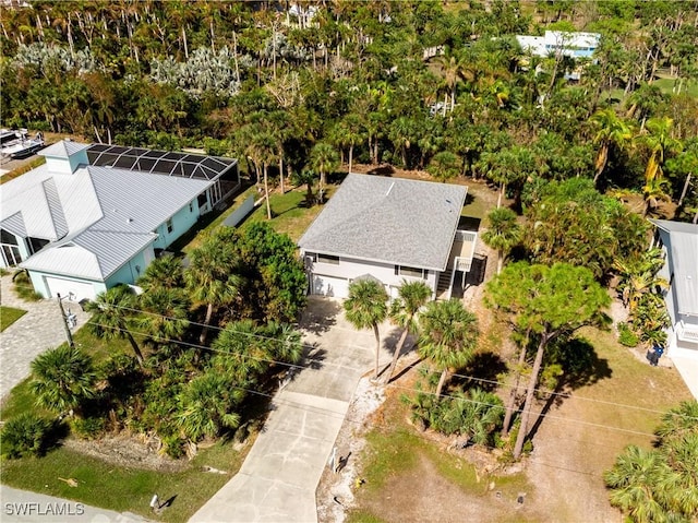 7836 Grande Pine Rd, Bokeelia, FL 33922 - aerial view of property and surrounding area with a tree filled landscape
