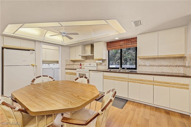 7836 Grande Pine Rd, Bokeelia, FL 33922 - kitchen with white appliances, separate washer and dryer, a sink, wall chimney exhaust hood, and ceiling fan