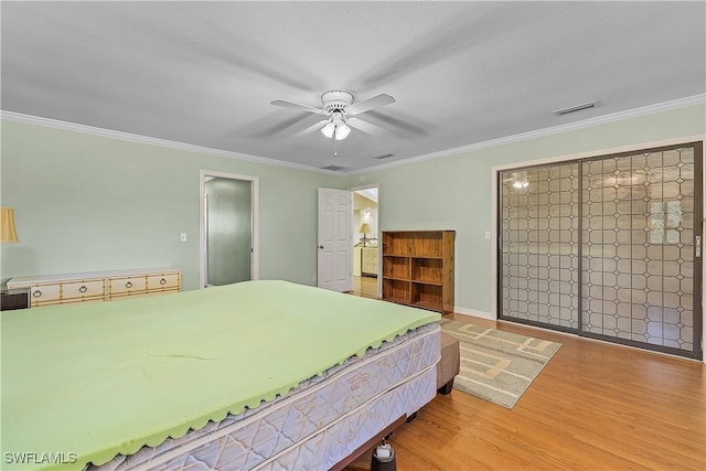 7836 Grande Pine Rd, Bokeelia, FL 33922 - bedroom featuring wood finished floors, crown molding, and ceiling fan