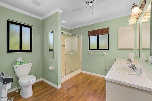 7836 Grande Pine Rd, Bokeelia, FL 33922 - full bath with wood finished floors, toilet, baseboards, crown molding, and a stall shower